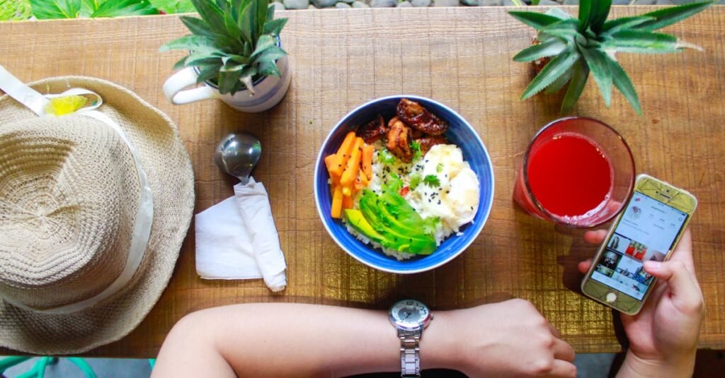 pexels-photo-1034940-1034940 Fresh and healthy bowl meal with juice and smartphone on a wooden table, perfect for lifestyle and food photography.
